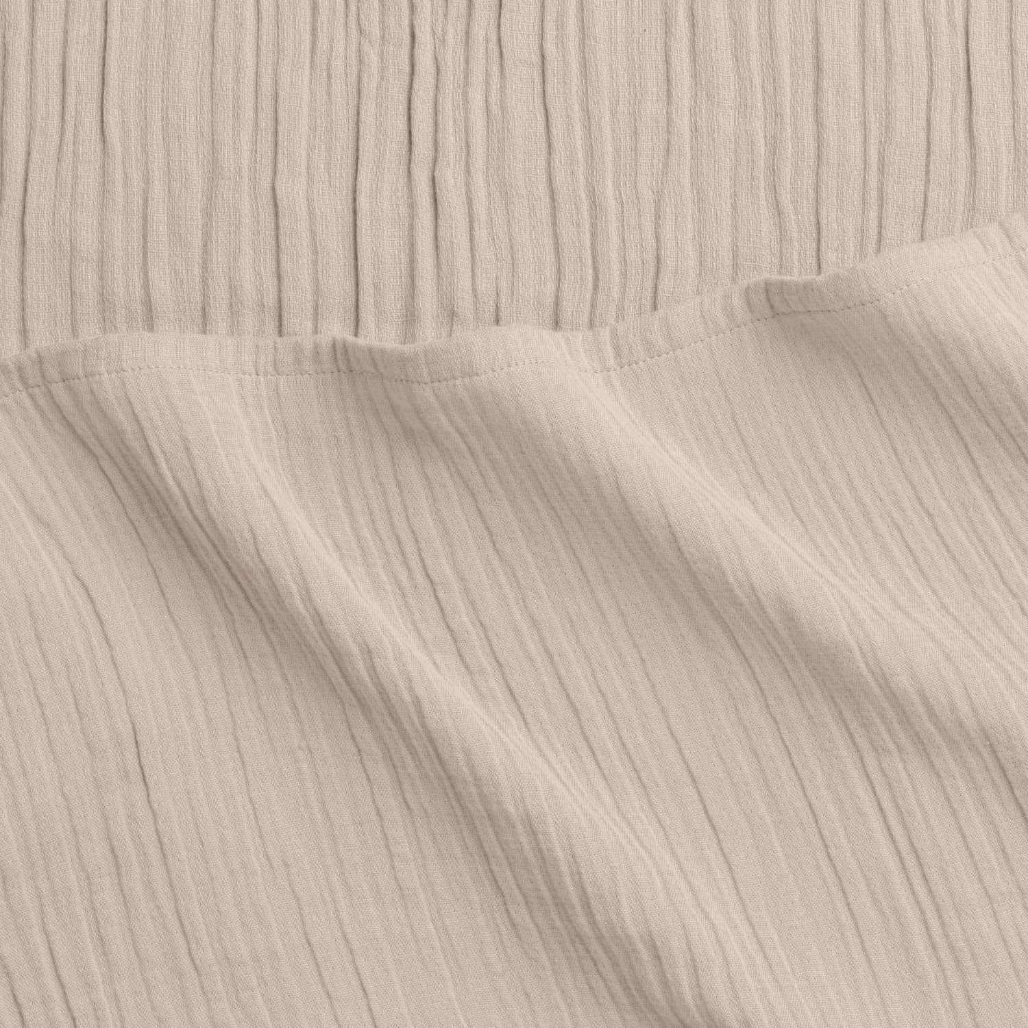 Cream woven fabric with slight folds and subtle vertical lines