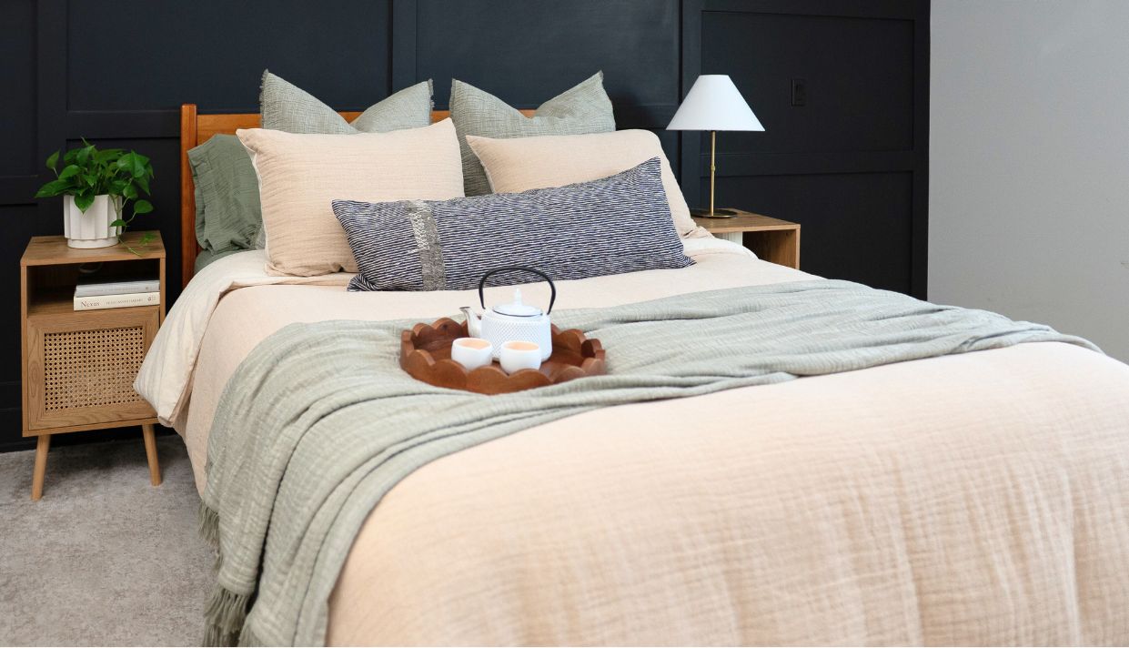 Neutral-toned room with layered textures and Crane Home textiles in a cozy setting.