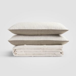 Crane home bedding posed on a white background