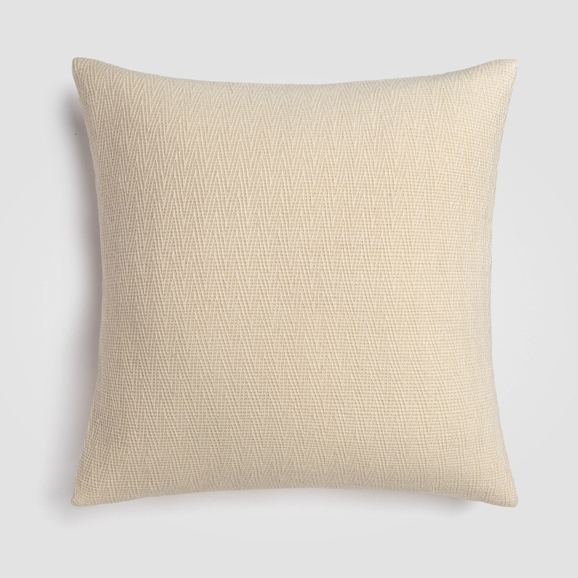 Pale cream pillow with a soft woven look