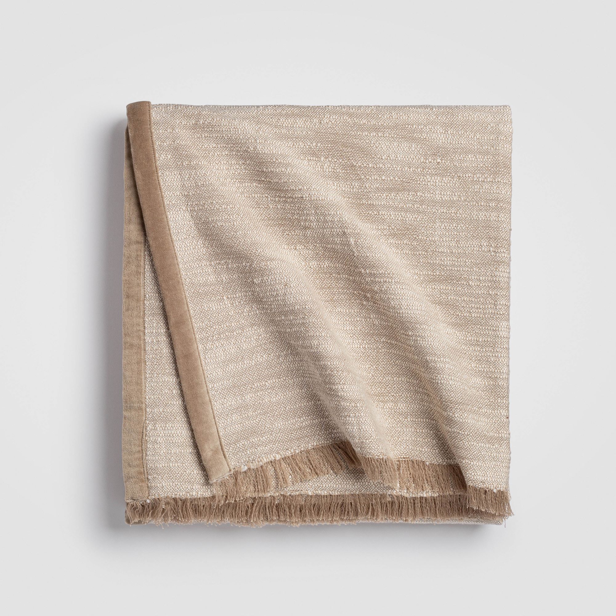 CH-200TH-1_(1)_HERO Folded beige cable knit throw blanket with a ribbed edge