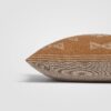 Rectangular rust and beige striped pillow with woven texture and fringe detail
