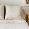 Close up of a pillow lying on a bed