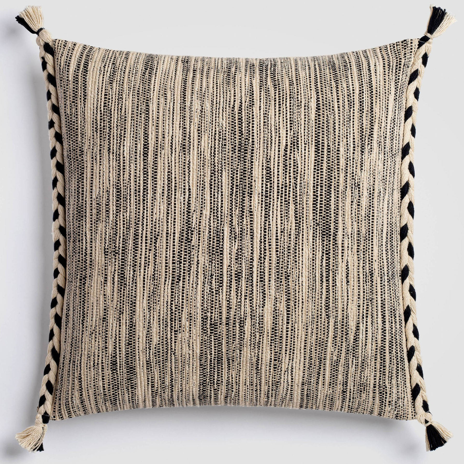 CH-220DP-1_(1)_HERO Cream pillow with a vertical stripe of thick black and gray stitching