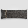 Rectangular pillow with color block design in beige and soft rust with visible weave texture