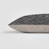 Rectangular pillow with speckled black and white weave and thick center stripe