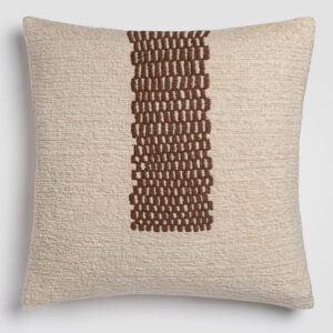 Beige pillow with a central vertical brown stitched detai