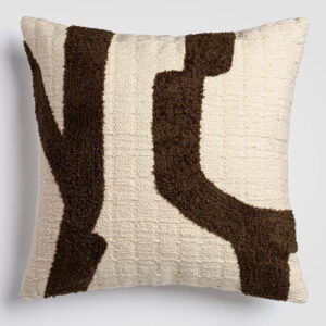 Cream pillow with large, bold abstract brown and black shapes