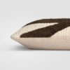 Side view of a beige and brown pillow with color-blocked stripe design