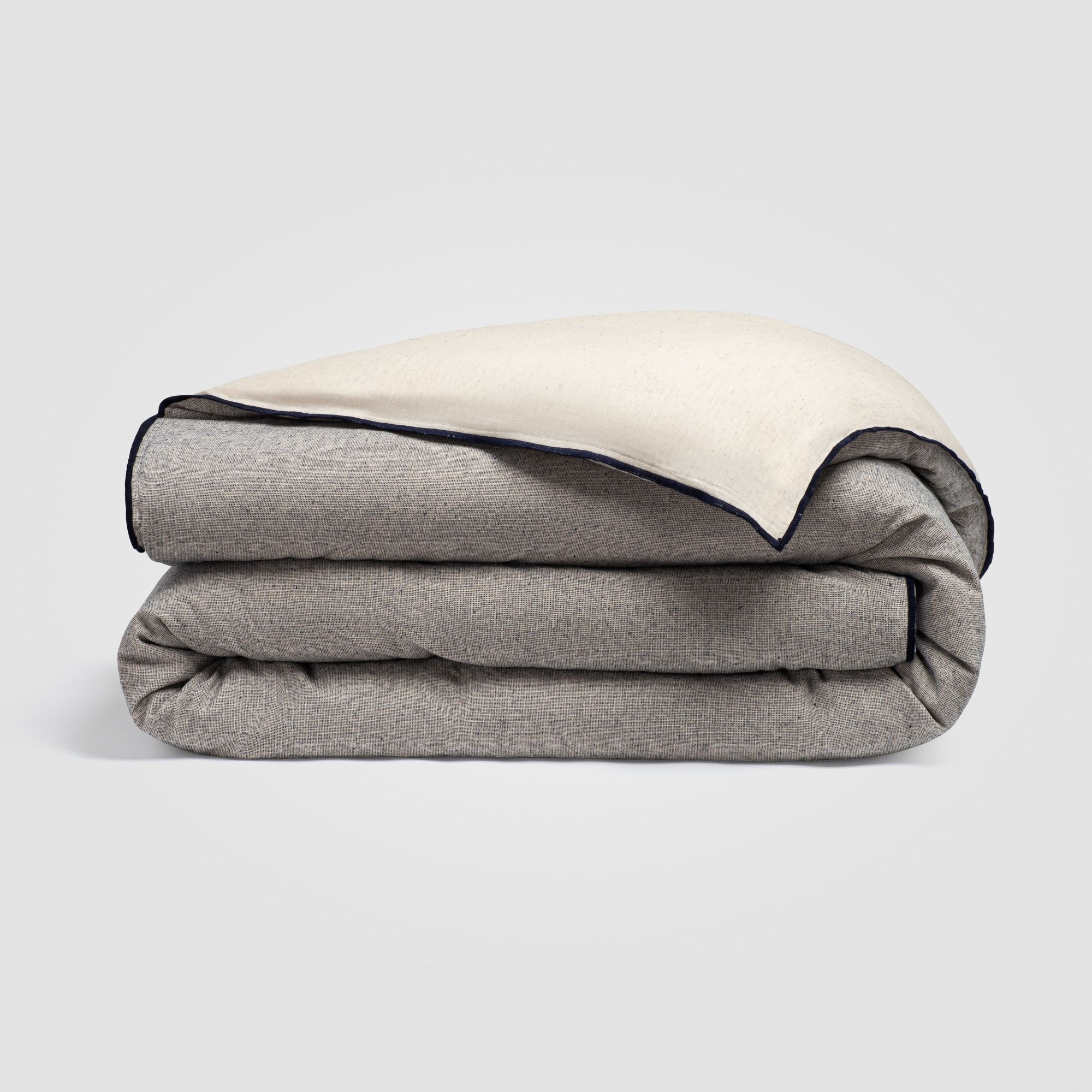 CH-230DC_(1)_HERO Folded gray-colored duvet cover on a plain white surface