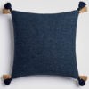 Solid navy blue decorative pillow with subtle texture