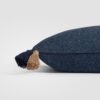 Side view of a dark navy pillow with visible textured weave