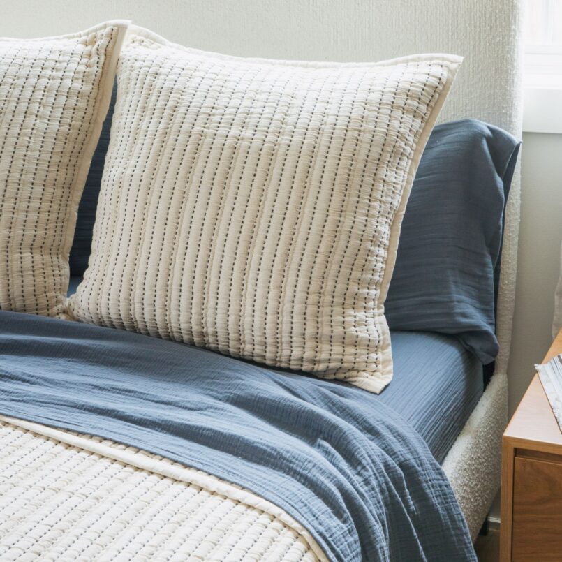 Crane home bedding posed in a real bedroom
