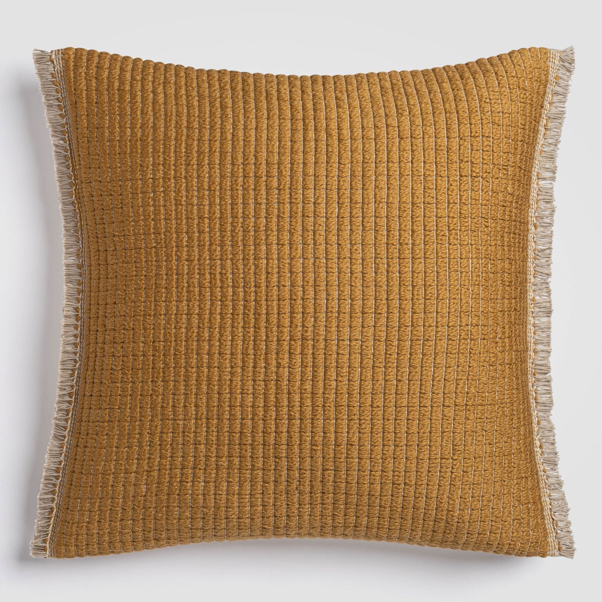 Solid mustard brown pillow with a smooth texture