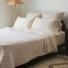 Crane home bedding posed in a real bedroom