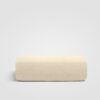 Folded beige sheet displayed on a white background