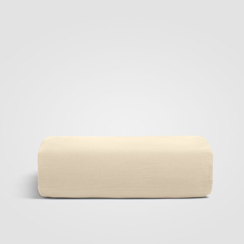 Folded beige sheet displayed on a white background