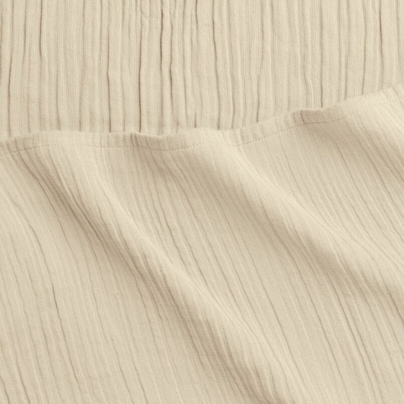 Close up of crane home bedding fabric to show detail