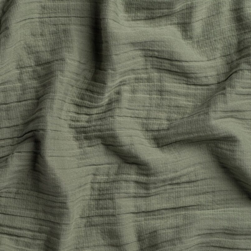 Close up of crane home bedding fabric to show detail