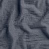 Close up of crane home bedding fabric to show detail